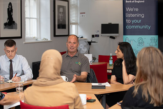People listening at a community forum event